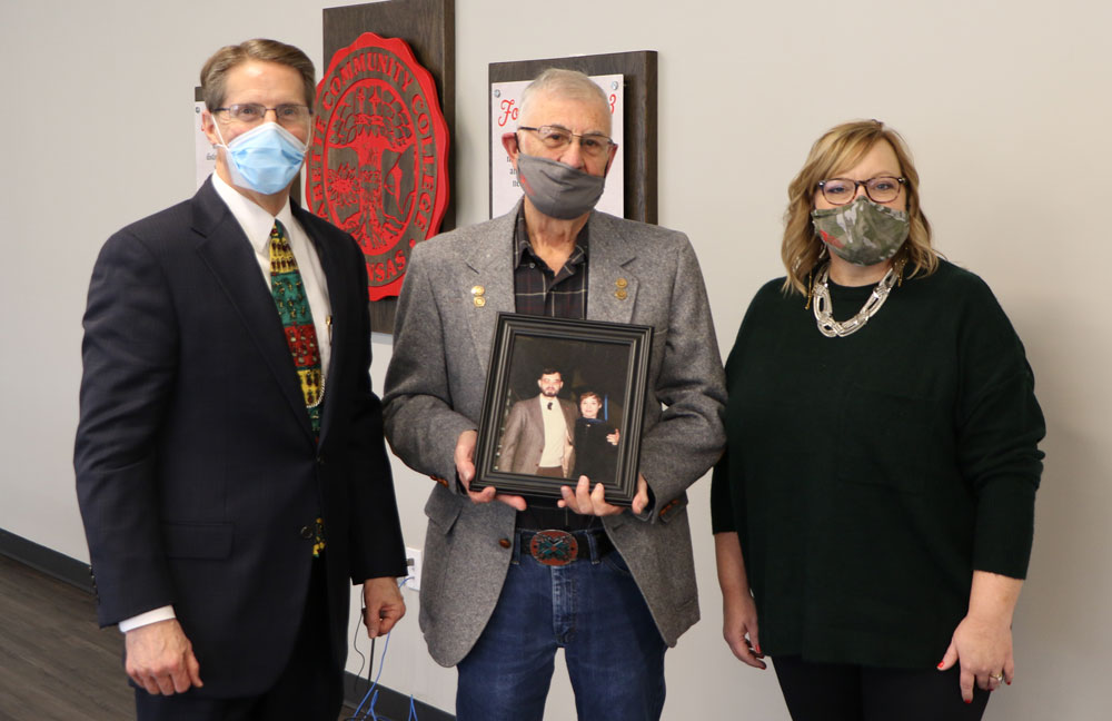 LCC President, Dr. Mark Watkins, and LCC Executive Director of Foundation and Alumni, Lindi Forbes stand with Ron Eads