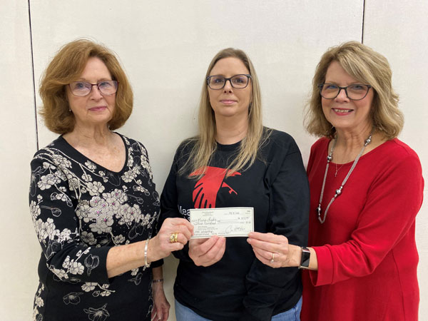 PEO member Janie Barcus and PEO president Debra Shaw present annual scholarship to Karie Leslie.