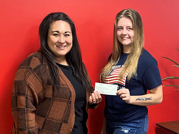 PEO member Daneen Landis-Coover presents annual scholarship to Kimberly Ourada.