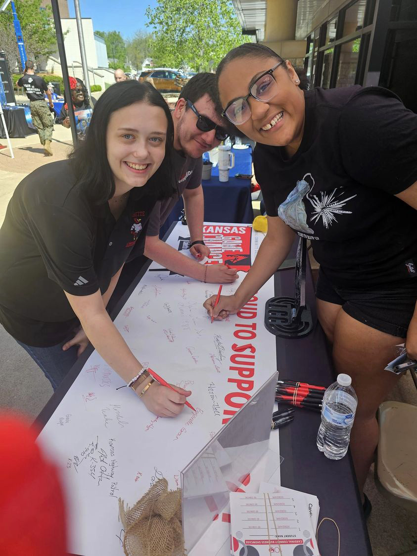 Students sign banner