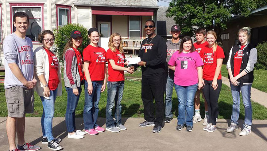 PR presents check to Youth Crisis Center