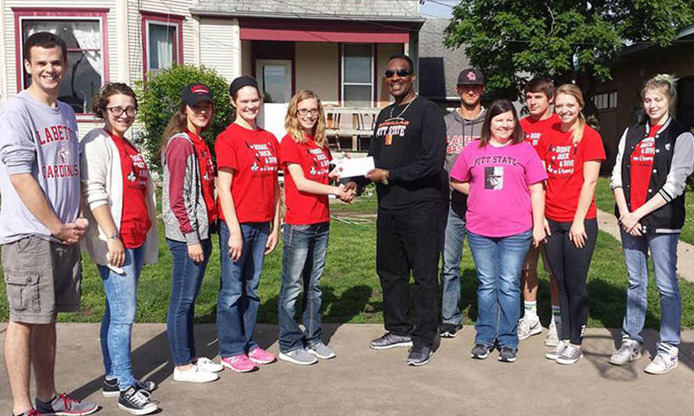 Public Relations presents check to Youth Crisis Center